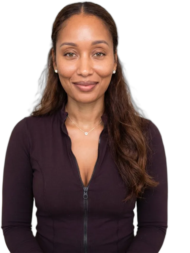 Lorraine Kamesha, PharmD, smiling in a plum top